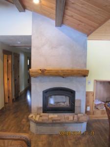 Stone wrapped fireplace