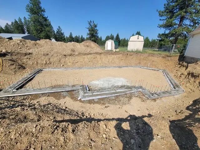 Poured concrete footings below the frost line for a basement addition in North Idaho